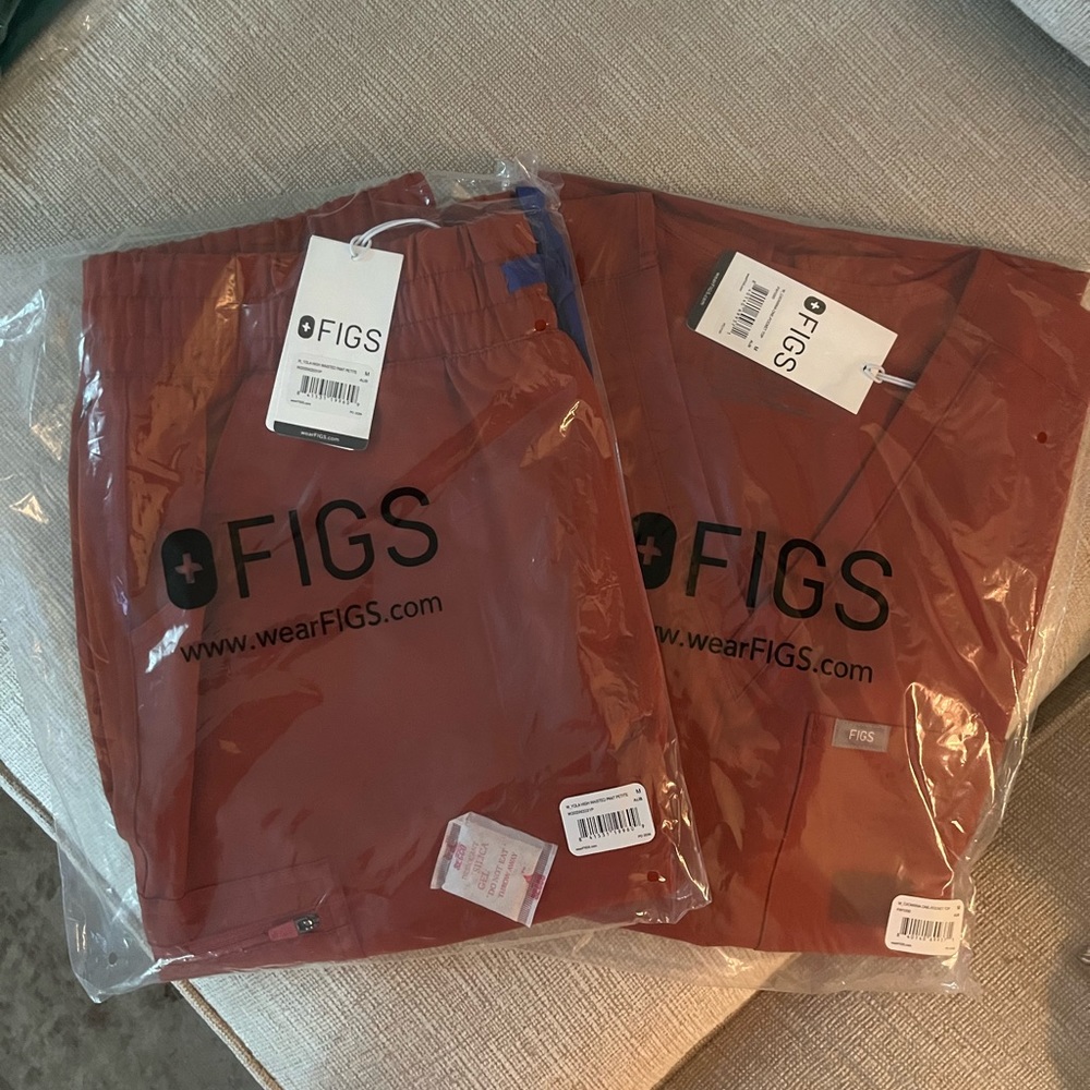 Brand new, tags on, never opened Figs Scrubs. Auburn color.